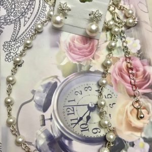 Fashion women’s pearl earring/necklace set.